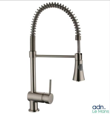 a close up of a kitchen faucet with a stainless steel finish