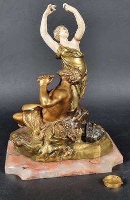 an image of a statue of a woman sitting on a marble base