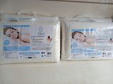 two pillows that are sitting on top of each other