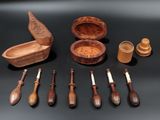 many wooden spoons and bowls on the table