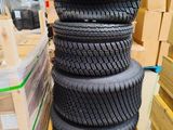 tires stacked up on pallets in a warehouse