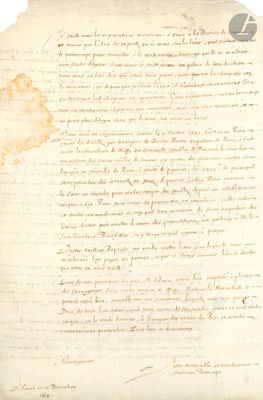 un vieux document sur lequel est posé un morceau de papier