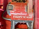 a red box with a drill and some wires in it
