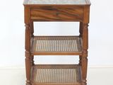 an image of a wooden table with a marble top and wicker shelves
