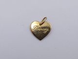 a small gold heart charm with the word person written on it