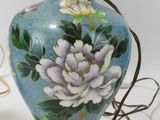 two vases that have been painted with flowers on them