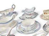 many different types of tea cups and saucers on the table