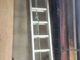a ladder that is leaning against a wall in a room