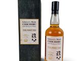 a bottle of chichibu single malt whisky next to a box