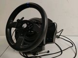 a black steering wheel and a black steering wheel on a white surface