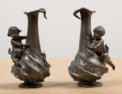 two vases that are sitting on a table