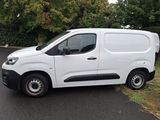 a white van parked on the side of the road