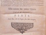 an old book that is open on a table