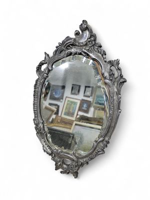 a mirror that is hanging on the wall in the room