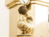 a clock that is on the side of a wall