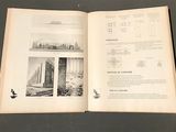 an open book with a picture of a city in it