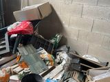 a pile of junk in the corner of a room