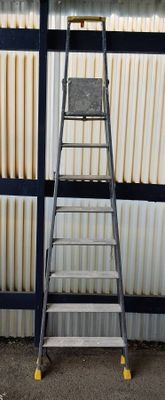 a ladder that is leaning against a wall