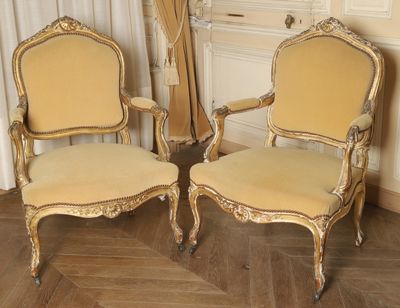 pair of antique french style chairs with gold paint and gold trim