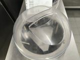 a clear bowl with a plastic lid on a counter