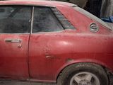 a red car that is parked in a garage