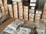 many boxes and packages on the floor of a warehouse