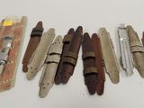 a lot of different types of knives on the table