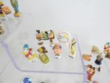 a lot of figurines that are on the table