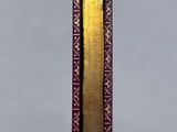 an image of a book with a gold strip sticking out of it ' s cover