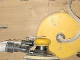 a close up of a piece of wood with a yellow object on it