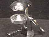 a silver object that is on a black surface