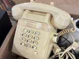 a phone that is sitting in a box on the floor