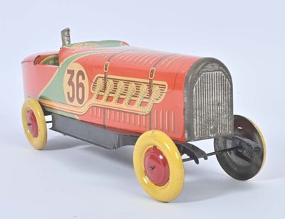 a red toy car with yellow wheels on a white surface