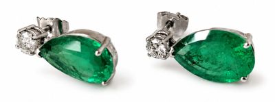 a pair of emerald and diamond earrings on a white background