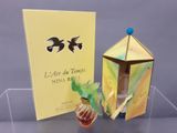a box with a perfume in it and a box with a perfume in it