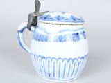 a blue and white cup with a bird on it
