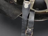 a close up of a helmet with a strap attached to it