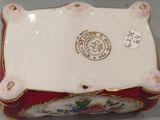 a white box with a red and gold design on it