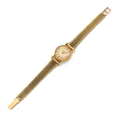 a lady ' s wrist watch with a gold plated bracelet