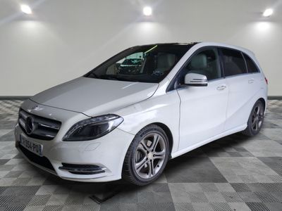 the mercedes b - class is parked on a checkered floor