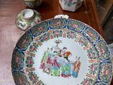 a plate with a picture on it sitting on a table