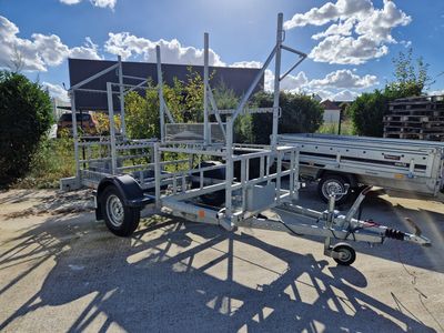 a trailer with a trailer attached to it in a parking lot