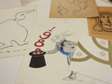 many cards with drawings on them on a table