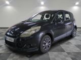 a picture of a small black car parked on a checkered floor