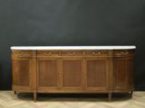 a very nice antique sideboard with marble top in the style of a buffet