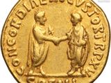 a gold coin with two men shaking hands in front of a white background