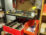 a shelf with many different tools on it in a room