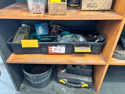 a shelf with tools and other items on it