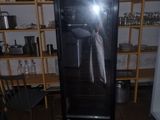 someone is taking a picture of a refrigerator in a kitchen