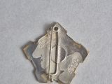 a small metal pin with a small metal pin on it